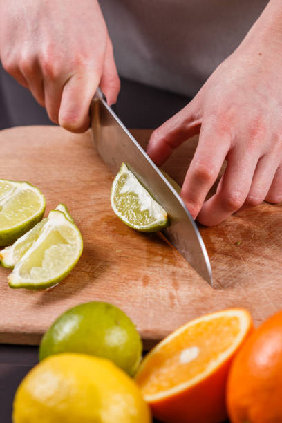 istock young woman in a gray aprons cut lime 1144831206