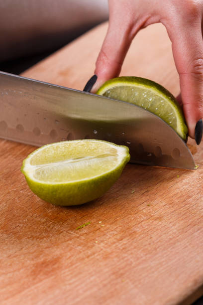 istock young woman in a gray aprons cut lime 1144831225