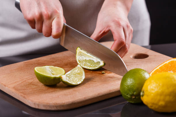 istock young woman in a gray aprons cut lime 1144831248