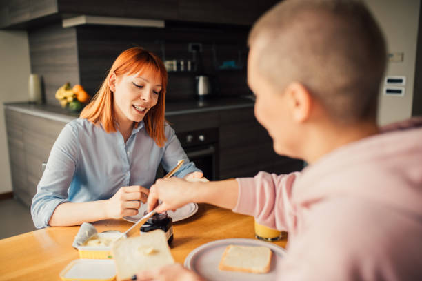 istock Girls having breakfast and smiling 1144832767