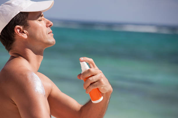 istock man applying sunscreen on the beach 1144832958