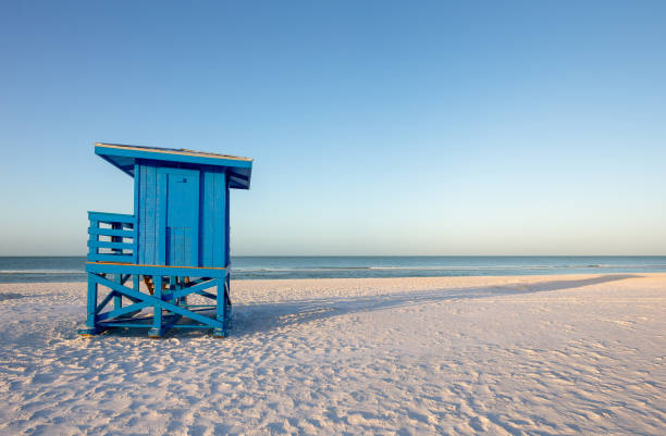 istock Blue Lifeguard Tower on an Early Morning Beach 1144834106
