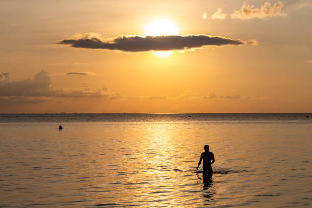 istock Man silouhette at sunset in Ko Phangan, Thailand 1144834525