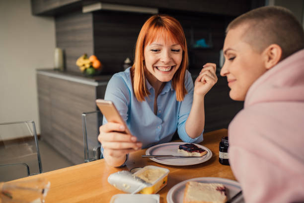 istock Girls with phone 1144836046