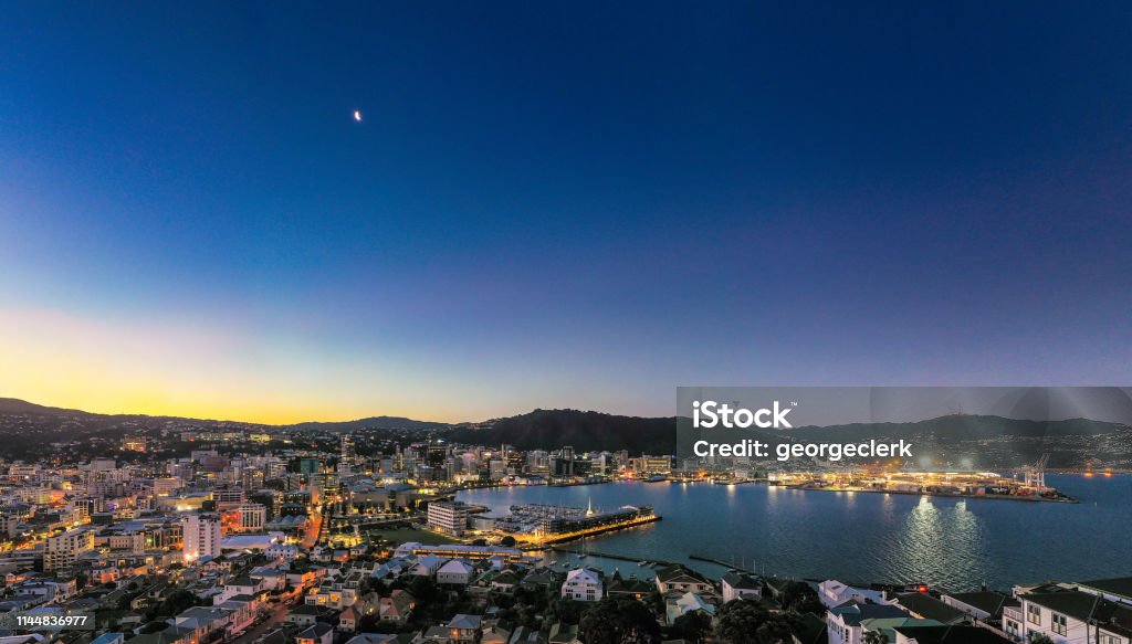 Wellington panorama at dusk A high angle view of New Zealand's capital city, Wellington at dusk. The city is located at the south of the country's North Island. Wellington Region New Zealand Stock Photo