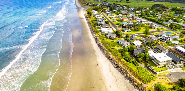 Holiday houses near the sandy beach at Waihi Beach, on the Coromandal Peninsula, in New Zealand's North Island.