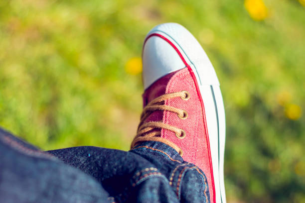istock Red vintage sneaker and dark blue jeans 1144838743