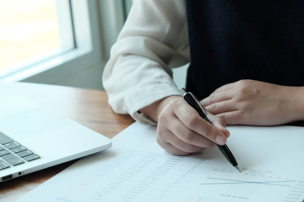 istock Business People Meeting Design Ideas  with pen analyzing financial documents professional investor working new start up project. Concept. business planning in office. 1144839155