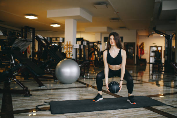 istock A beautiful girl is engaged in a gym 1144839998