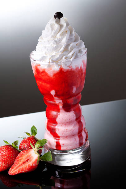 istock Strawberry Milkshake on black background 1144840579