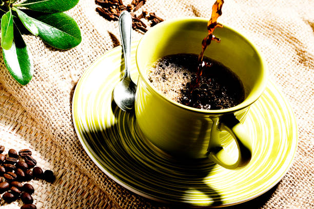 istock Coffee cup on wood background with coffee grain 1144841372