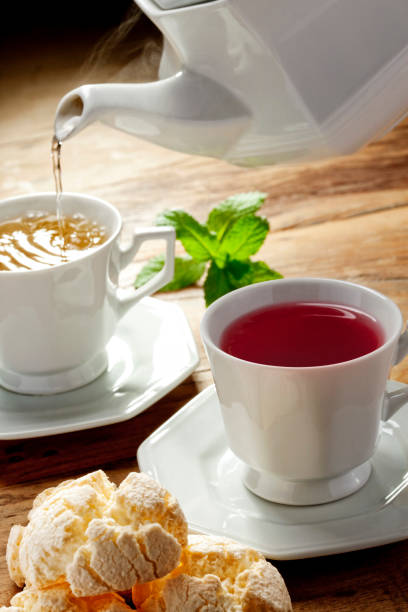 istock Cup of red fruits tea with cheese bread 1144841393