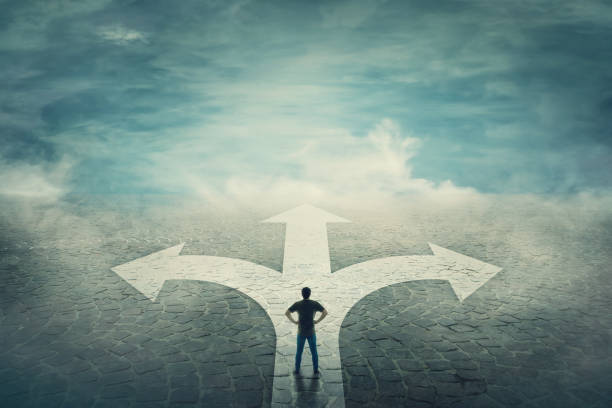 istock Confident man stands in front of a crossroad 1144843403