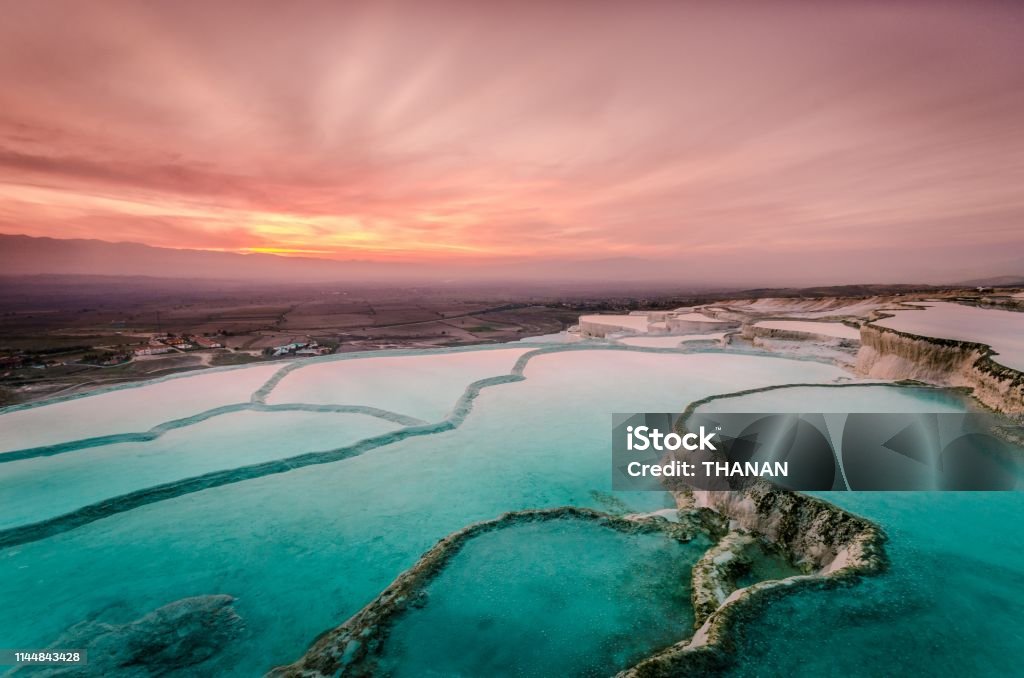 Carbonate travertines the natural pools during sunset, Pamukkale Carbonate travertines the natural pools during sunset, Pamukkale, Turkey Pamukkale Stock Photo