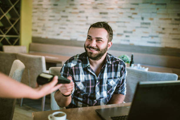 istock Credit Card Payment In Coffee Bar 1144844680