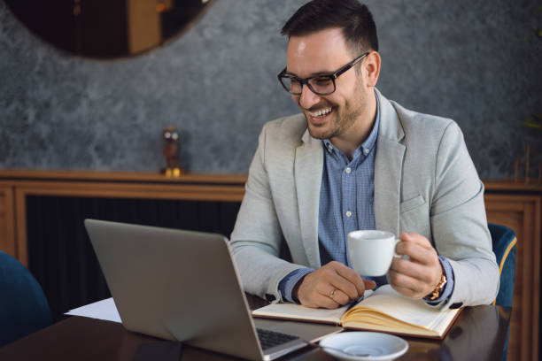 istock Mid adult  man drinking coffee in a cafe 1144849478