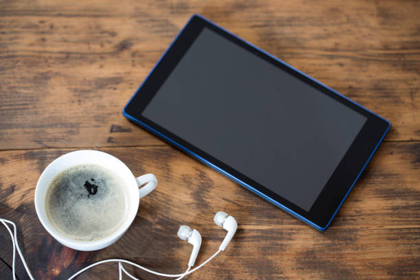 istock Digital tablet and a cup of coffee 1144851883