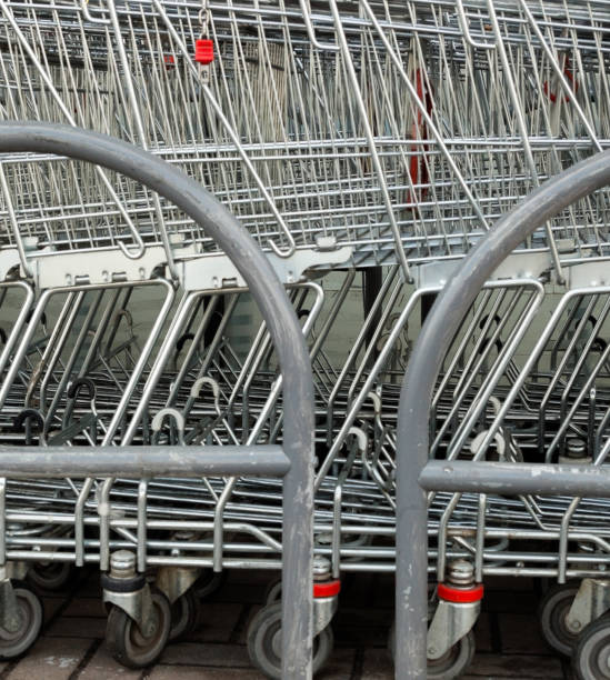 istock A row of parked shopping carts (trolleys) 1144851926