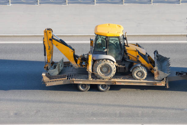 trailer carrying backhoe