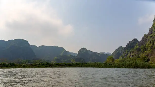 beautiful mountain scenery on sunny day with rainforest in ninh binh Vietnam
