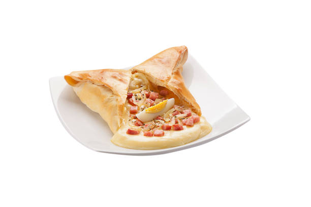 istock Salty calzones with dish on white background 1144854011