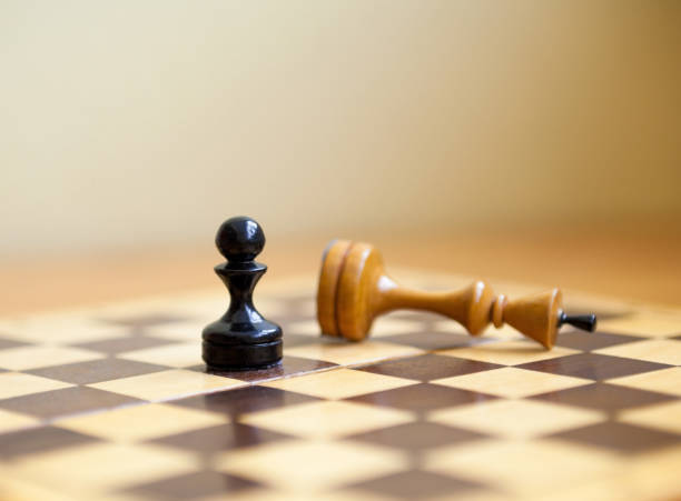 istock Pawn wins a victory over the king. Chess pieces. 1144854058
