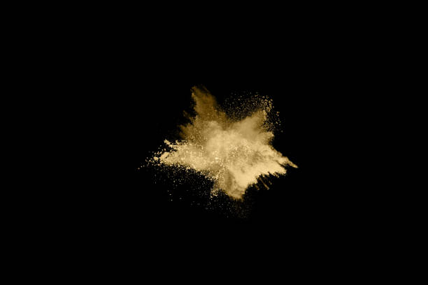 istock Golden powder explosion on black background. Freeze motion. 1144855169