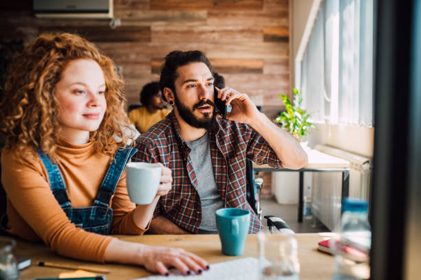istock Coworkers having cup of coffee 1144856287