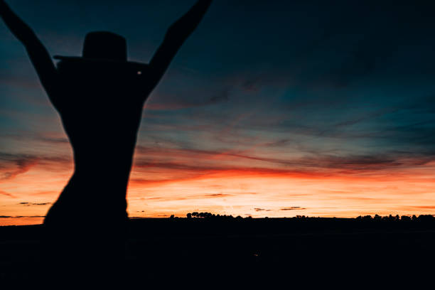 Woman silhouette in the beautiful sunset