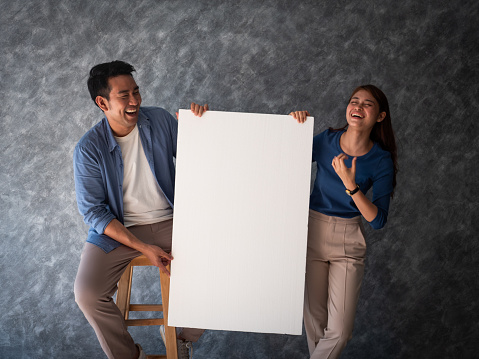 Asian Man and woman couple with white banner copy space
