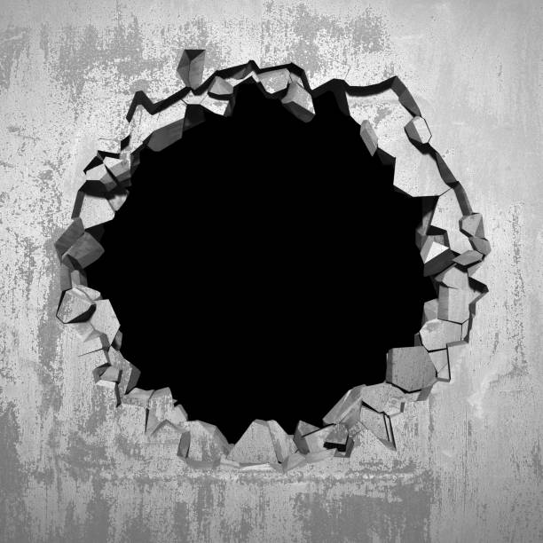 istock Dark cracked broken hole in concrete wall 1144858008