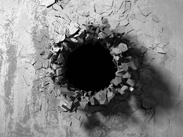 Dark cracked broken hole in concrete wall stock photo
