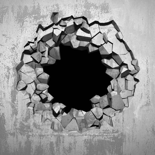 istock Dark cracked broken hole in concrete wall 1144858909