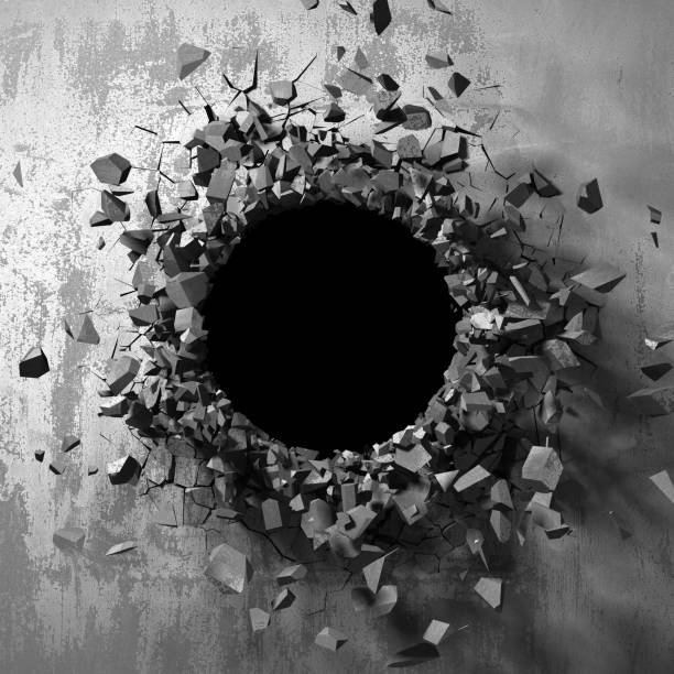 istock Dark cracked broken hole in concrete wall 1144859313