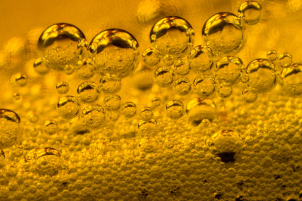 istock air bubbles in golden liquid abstract 1144864915