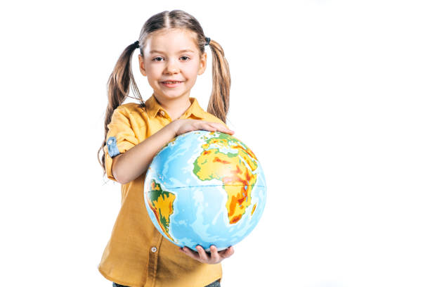 istock adorable smiling kid holding globe isolated on white, earth day concept 1144866331