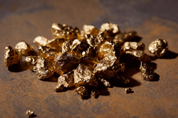 istock selective focus of golden stones on marble background 1144867378