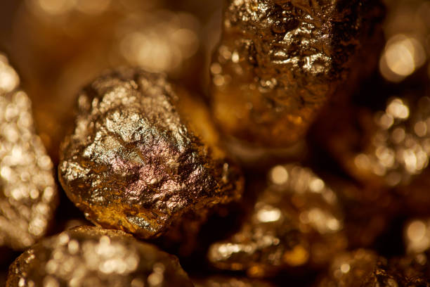 istock selective focus of golden stones with sparkling lights 1144867449