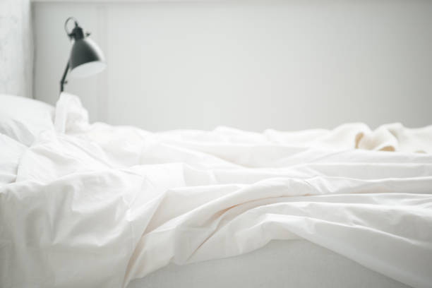istock Selective focus of empty white bad and lamp 1144867642