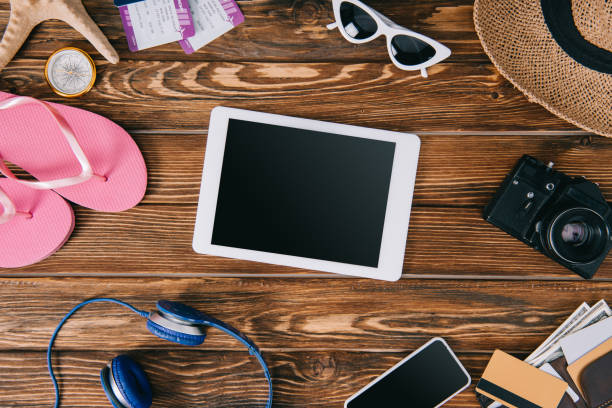 istock top view of digital tablet with blank screen and travel items around 1144868571