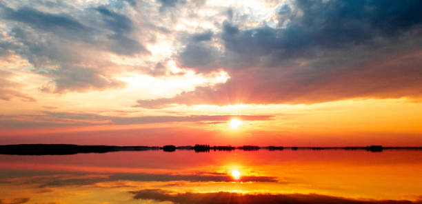 istock Sunset on the lake. Evening river. Sunset on the water horizon. 1144871083
