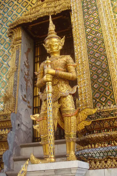 Photo of Golden statue of ancient guard in Wat Phra Keao