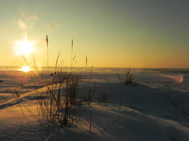 istock Sunset on the sea in the ice. 1144872640