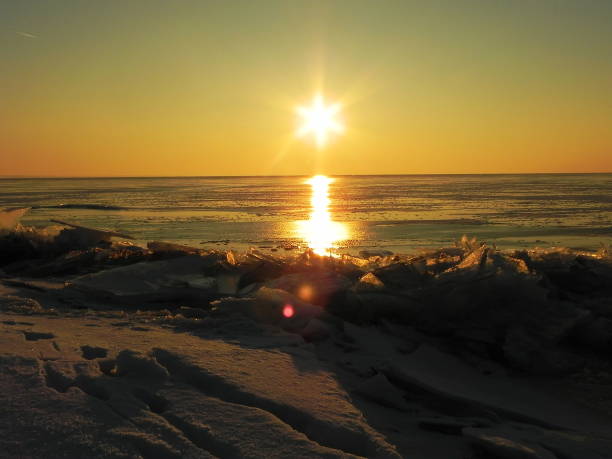 istock Sunset on the sea in the ice. 1144872643