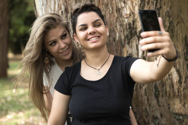 istock Lesbian Couple Taking a Selfie at Park 1144872920