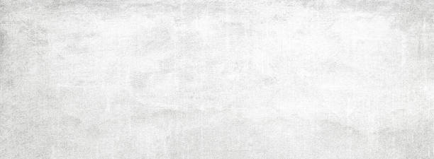 istock Long wide panoramic background in horizontal position.Monochrome light texture with shade of gray color. Grunge old wall texture, concrete cement background. 1144872924