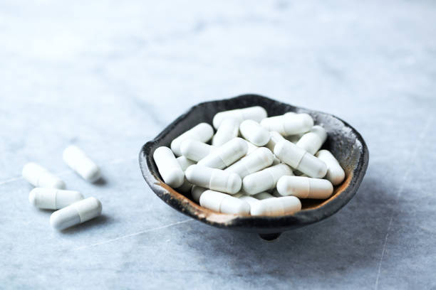 istock Tribulus terrestris extract. A Dietary Supplement. Bright stone background. Copy space. 1144873024