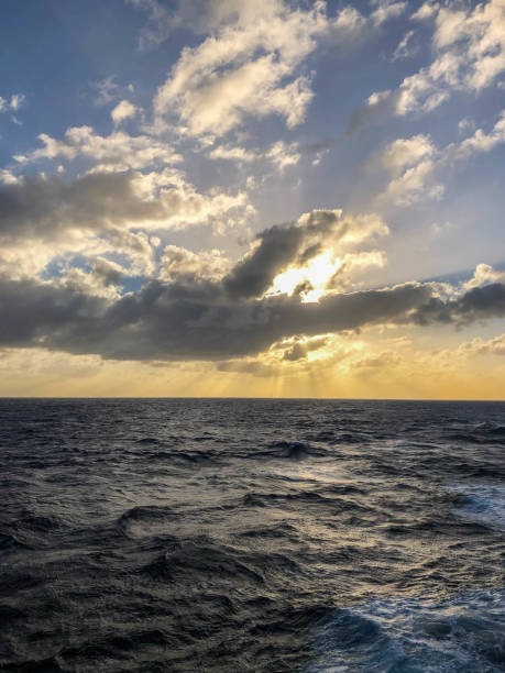 istock Sunset over Caribbean sea under moody skies 1144875236
