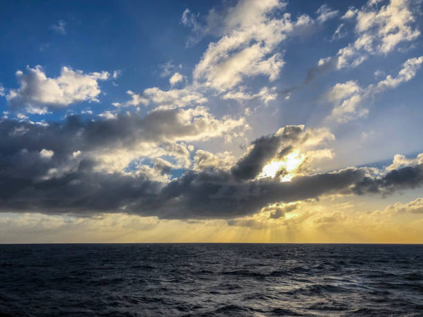 istock Sunset over Caribbean sea under moody skies 1144875765