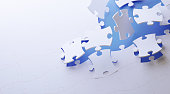 Puzzle Concept - White Jigsaw Puzzle Pieces On Blue Background